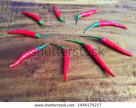Red pepper, chili on old wood background