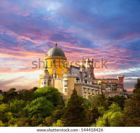 Fairy Palace against sunset sky /  Panorama of Pena National Palace in Sintra, Portugal / Europe Royalty-Free Stock Photo #144418426