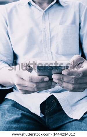Man using mobile phone, pastel color photo