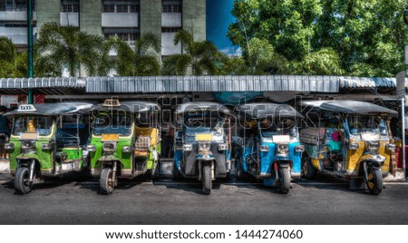 HDR image of Tuk Tuk Rickshaw taxi lined up at Bangkok
