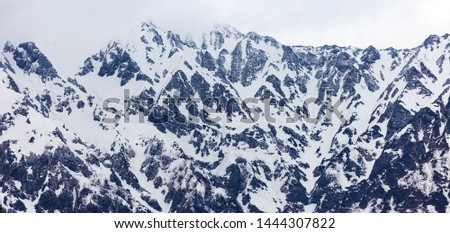 Landscape view of Japan Alps, Tateyama Kurobe Alpine Route in high mountain cover with snow in late winter season, A beautiful  Natural movement