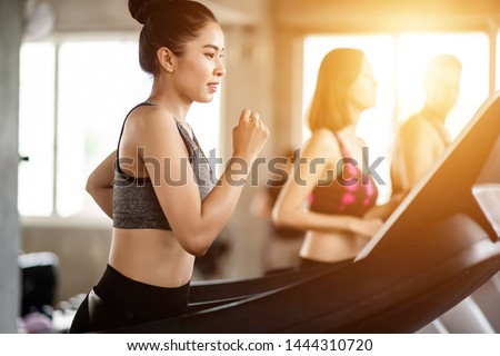 Young healthy woman cardio on a treadmill at the gym
 Royalty-Free Stock Photo #1444310720