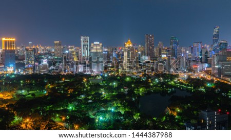 panorama photography of aerial view of Lumpini Park and Bangkok city in night time. (With blur trademark, brand, logo)
