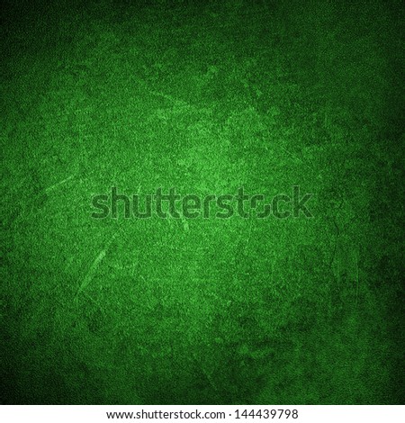 green background or green paper with bright spotlight on black background texture, for Christmas card or Christmas background or for St. Patrick's Day background, with vintage grunge texture