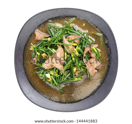 Top view of stir fried pork liver with vegetable on white background