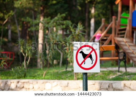 Prohibition sign no dogs in children playground. Animals not allowed in park.