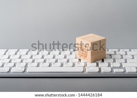 Business, marketing & online shopping strategy concept icon on the cube & computer keyboard