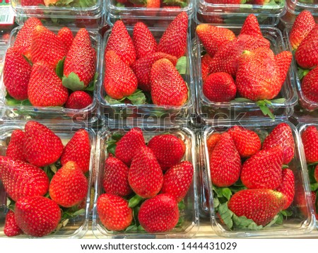 Strawberries in boxes for sale