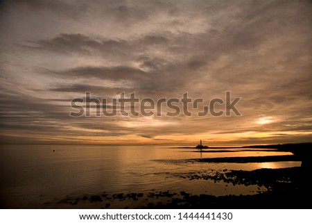 This image was taken from Collywell Bay in Northumberland just after sunrise, looking south towards St Mary's Island and lighthouse which can be spotted on the horizon. 