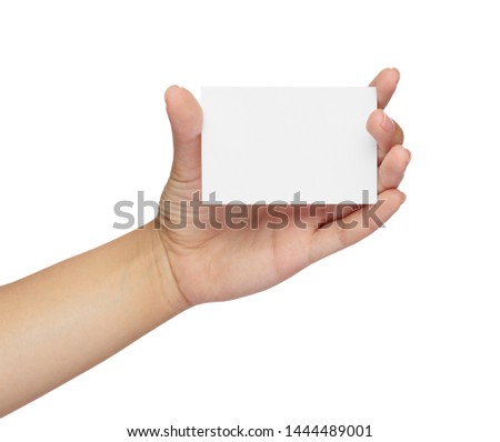 close up of  a female hand holding blank note card sign on white background