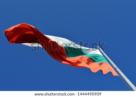 Flag of Bulgaria from below on the border of state, in the windy and sunny day, Bulgaria
