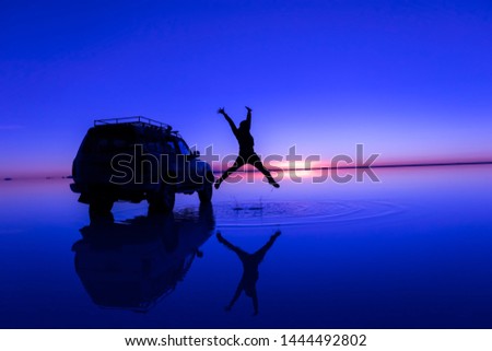 Silhouette photo jumping in Salar de Uyuni