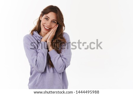 Girl telling about lovely date sighing cheerful romantic lean head palms touched delighted smiling silly watching heartwarming melodrama standing white background purple hoodie sympathizing Royalty-Free Stock Photo #1444495988