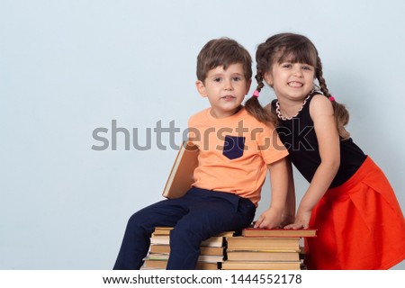 Back to school creative background with school children. Cute boy and girl likes knowledge and happy back to school.