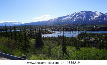 
Landscape of forest lakes and mountains in Yukon, Canada on the border with Alaska