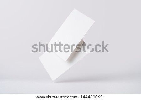 Design concept - front view of 2 surreal white business card float on mid air isolated on white background for mockup, it's real photo, not 3D render
