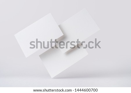 Design concept - front view of 3 surreal white business card float on mid air isolated on white background for mockup, it's real photo, not 3D render