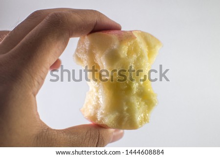 Man's hand with apple and White background : Apple bite
