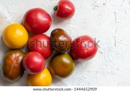 different color tomatoes, red, pink, brown and yellow, organic products