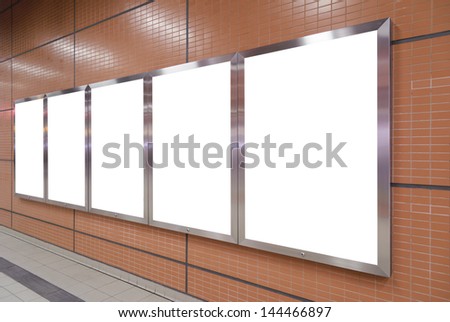Five big vertical / portrait orientation blank billboard on brown wall