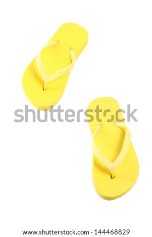 picture of yellow flip flops isolated on white background
