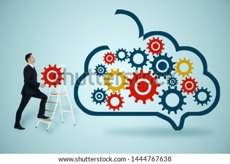Data storage network technology concept. Businessman walking with creative gear from cloud and cogs on subtle background