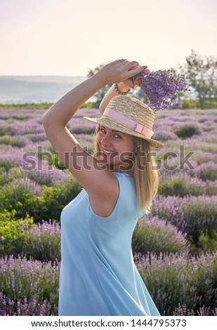 cute woman standing on a beautiful lavender field