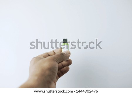 white and green thumb drive isolated white background. 