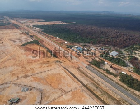 Aerial view at the construction site during earthworks progress.