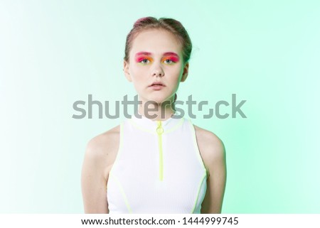 serious woman with bright neon makeup