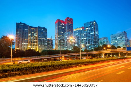 Light trails on the street at Beijing Central Business district at night in Beijing ,China.