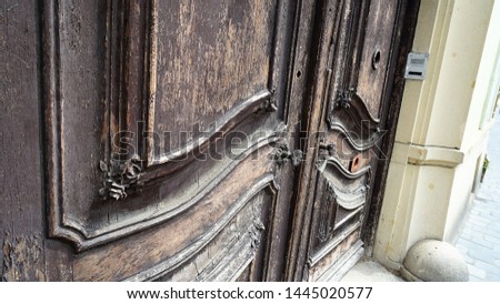 Vintage brown wooden door in aged and faded conditions