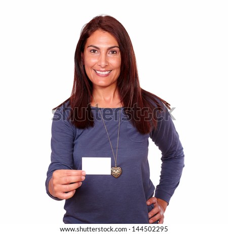 Portrait of a smiling senior woman holding up a blank business card of copyspace on isolated background
