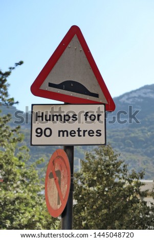 bump sign. Humps for 90 metres.