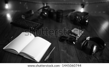 The photographer's desk, digital camera accessories and lenses
