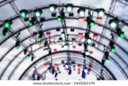 Construction with Spotlights and multicolored Lights at the Stage Picture as Background