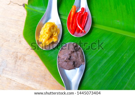 Palm sugar; shrimp paste; chilli; Separate scoop into a spoon, placed on banana leaf in Thailand - Picture