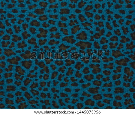 Cotton fabric with animal print. Animal pattern background or texture. Texture leopard.