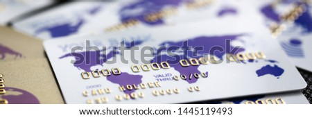Many bank cards scattered on table background. Making discount plastic concept.