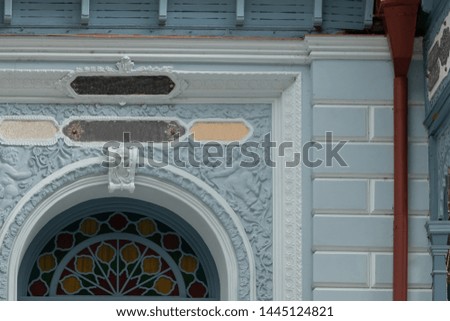 Elements of architectural decorations of buildings, balconies and arches, gypsum stucco, plaster patterns. On the streets in Georgia, public places.