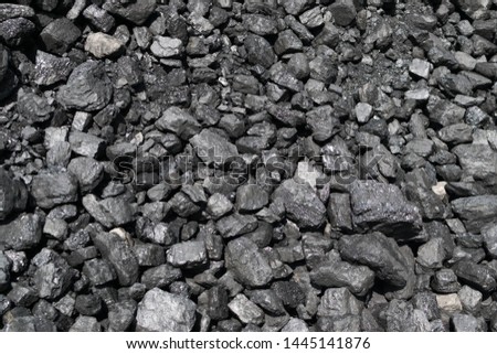 Pile of natural black hard coal for texture background. Best grade of metallurgical anthracite coals often referred to as stone coal and black diamond coal Royalty-Free Stock Photo #1445141876