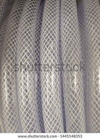 light gray background with vertical curved patterned stripes close-up shot with real natural photography