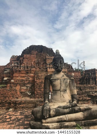Old Buddha statue and old town
