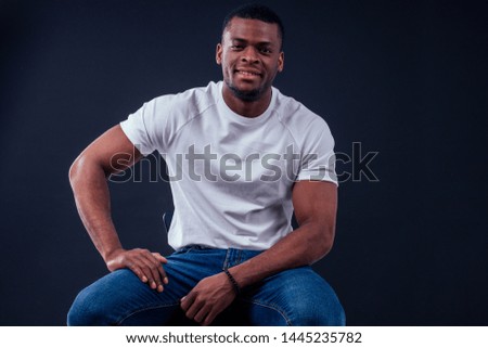 African American healthy male model in a cotton white t-shirt in studio summer lifestyle