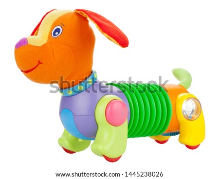 Cheerful children's toy dog on wheels.