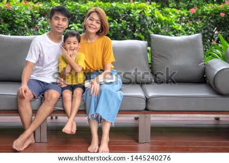 Asian Family relaxing on sofa at outdoor