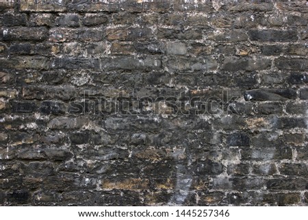 Very dirty weathered painted brickwork wall background texture with rough surface