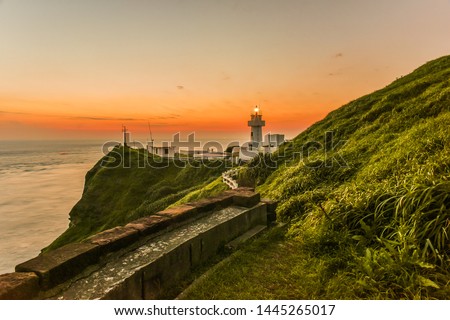 Landscape View of A Beautiful White Lighthouse (Bitou Lighthouse) At Twilight, The Northeast Coast of Taiwan, New Taipei City, Taiwan