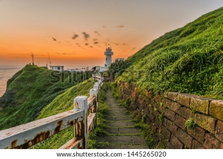 Landscape View of A Beautiful White Lighthouse (Bitou Lighthouse) At Twilight, The Northeast Coast of Taiwan, New Taipei City, Taiwan