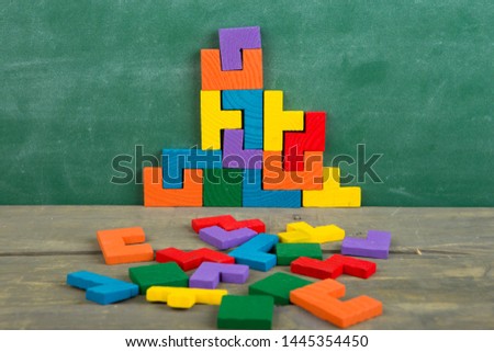 Creative solution for idea - business concept, jigsaw puzzle on the green blackboard background Royalty-Free Stock Photo #1445354450